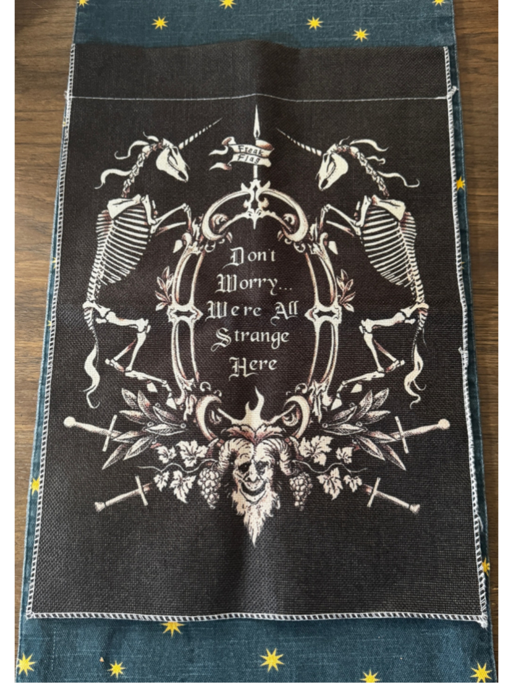 “We’re All Strange Here” Skeleton Unicorn Garden Flag 13” x 18”